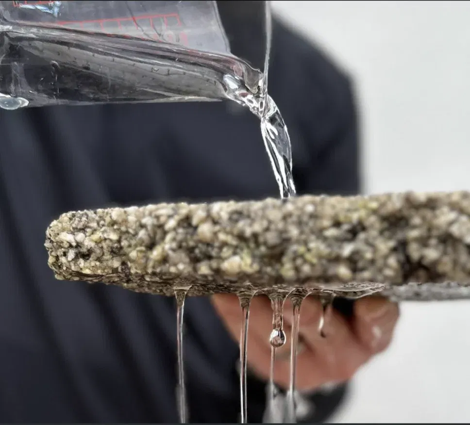 Water pouring through a permeable resin-bound sample